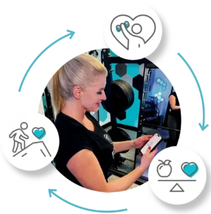 Woman checking her Forge app during a workout.